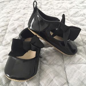 Black patent flats with black grosgrain bow