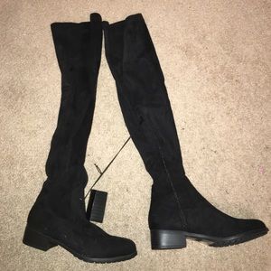 Black tight over the knee boots