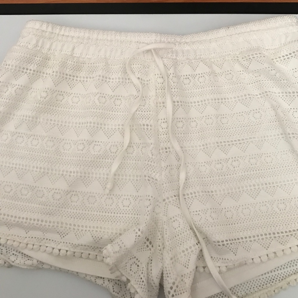 White lace cut off shorts