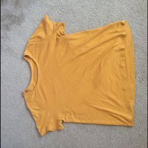 A mustard yellow T-shirt
