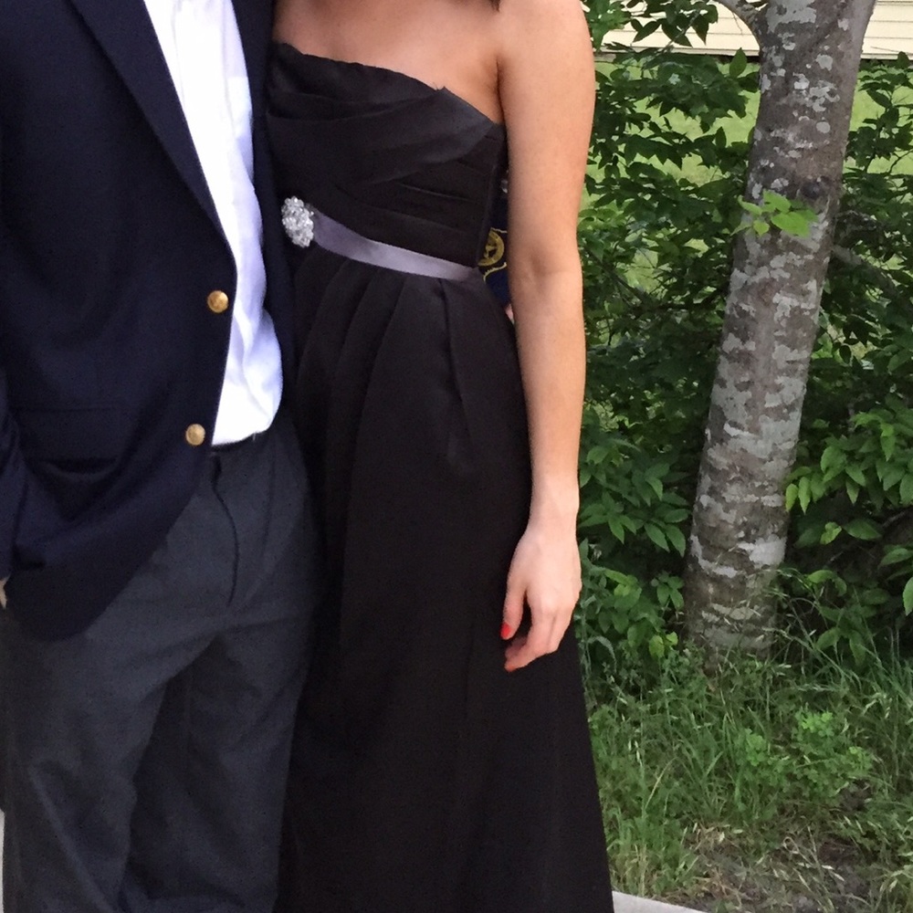 Black formal gown with crystal brooch