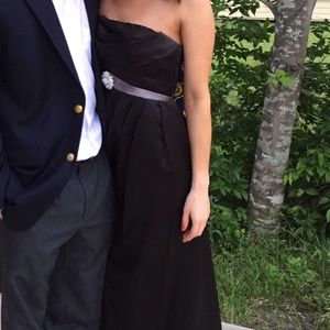 Black formal gown with crystal brooch