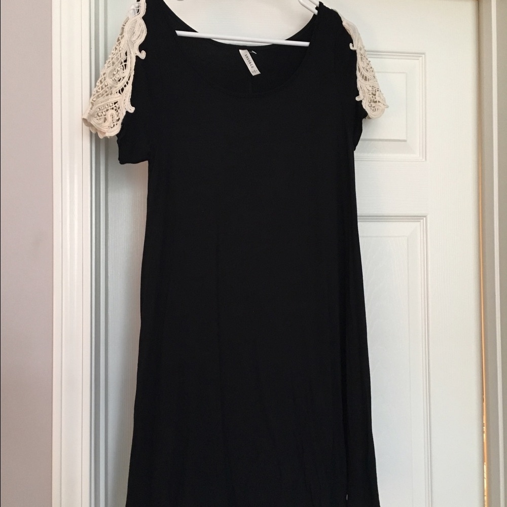 Black jersey dress with white lace sleeve detail