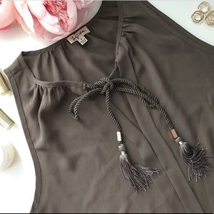Sleeveless blouse with tassels