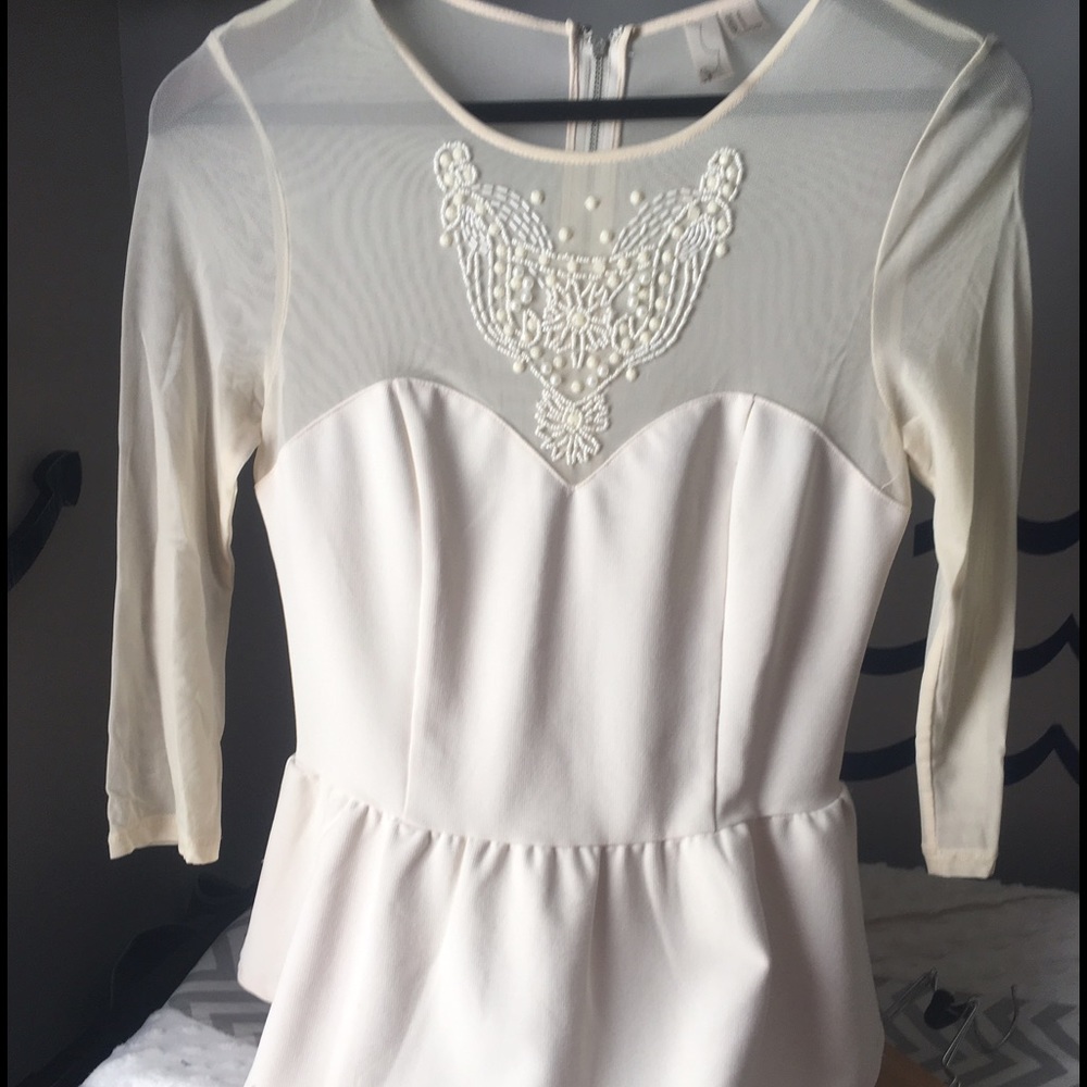 Forever 21 cream peplum blouse with beaded detail