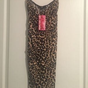Leopard mini dress fitted, stretchy. Never worn.