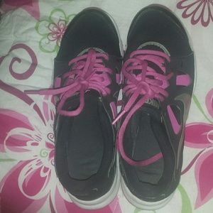 A pair of black, pink & white nikes
