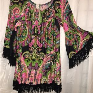 Cute blouse with fringe sleeves and bottom!