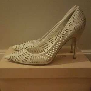 BCBG Ovation Lazer-Cut White Pumps
