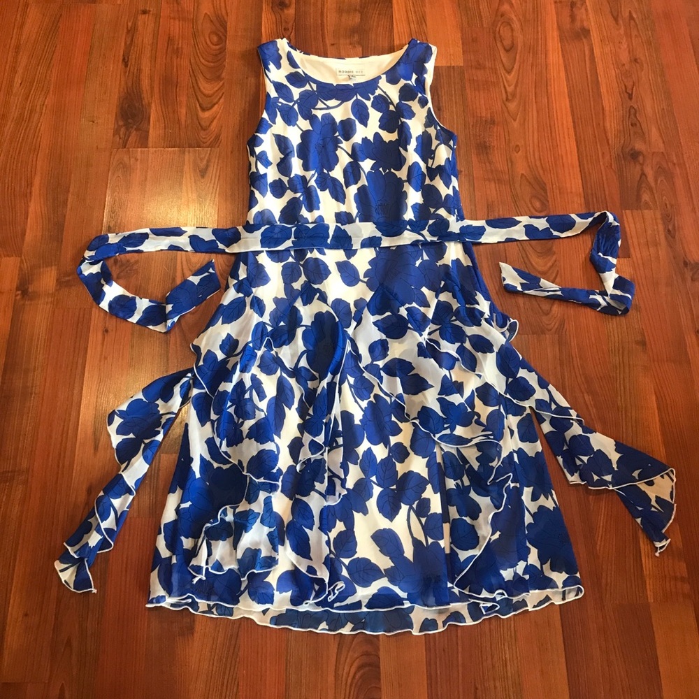 Ruffle bottom white dress with royal blue leaves