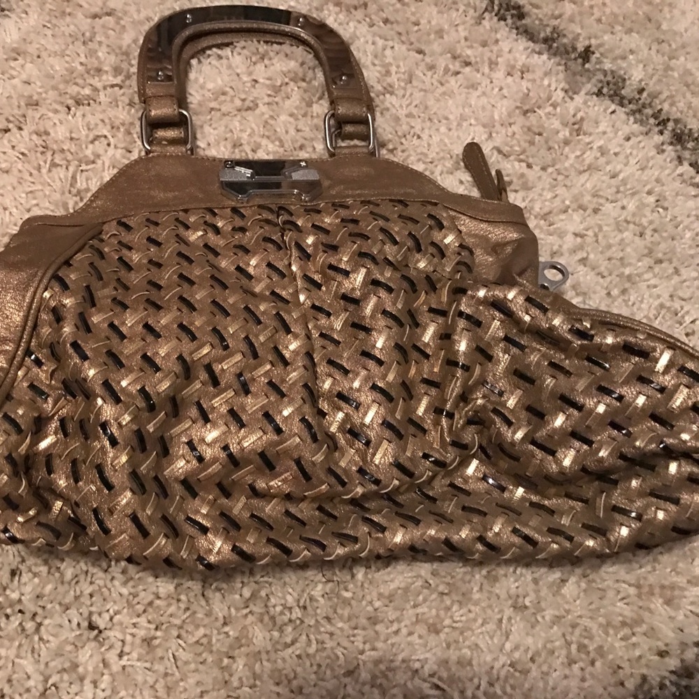 Medium size black and gold uddini purse