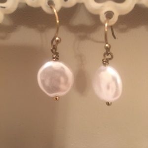 Pearl earrings.