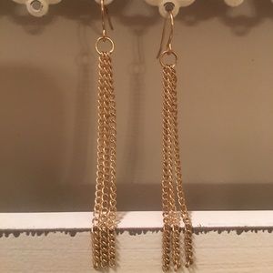 Gold earrings.