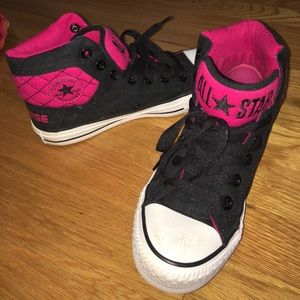 Pink and black high top converse