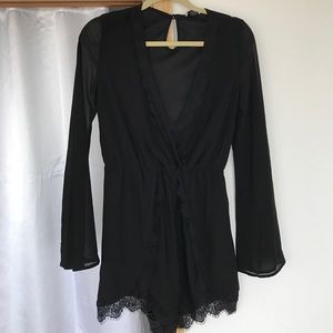 Black long sleeve romper with lace detail