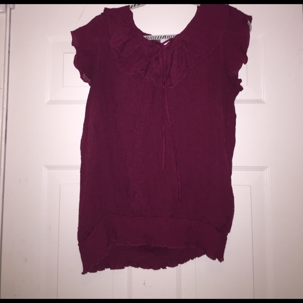 Ruffled sleeveless top with banded bottom