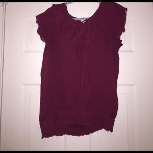 Ruffled sleeveless top with banded bottom