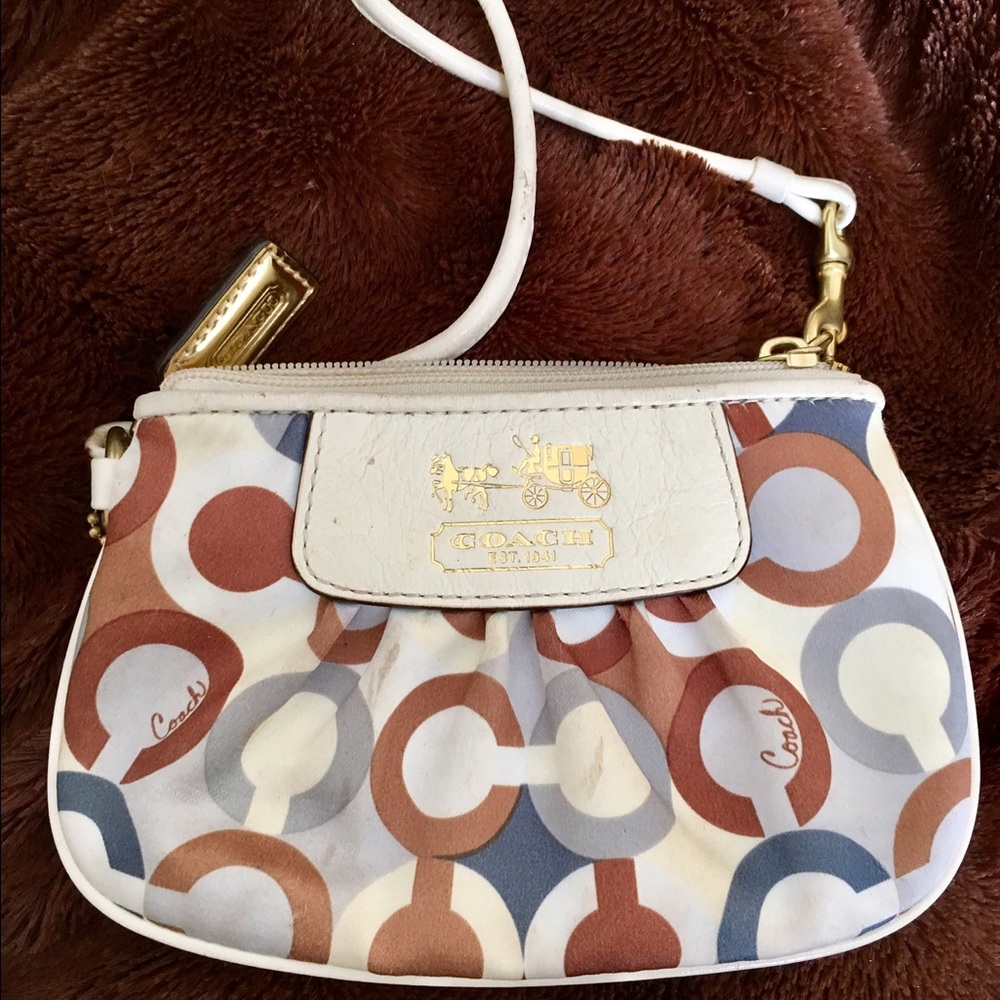 Coach poppy wristlet . Few stains. Lots of life!!!