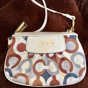 Coach poppy wristlet . Few stains. Lots of life!!!