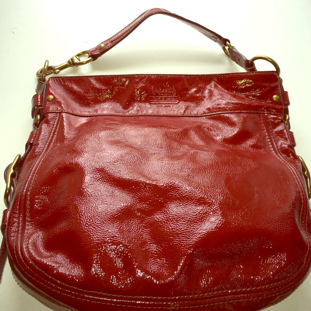 Coach red patten leather hobo bag.