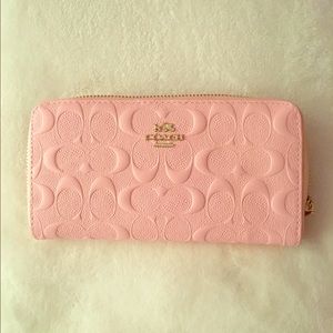 Embossed accordion zip wallet