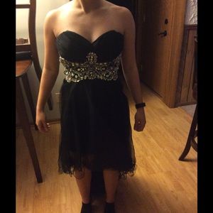 Beaded prom corset with ruffled train