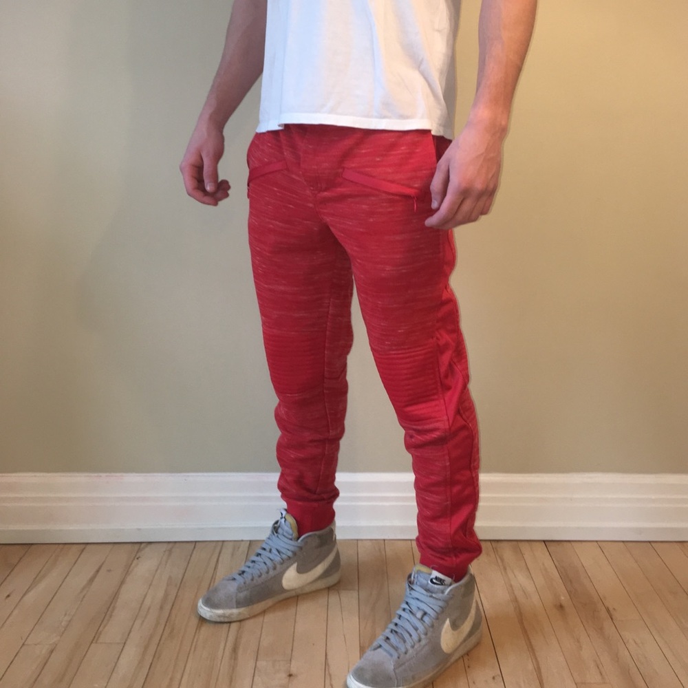 Red jogger pants with moto inspired knees