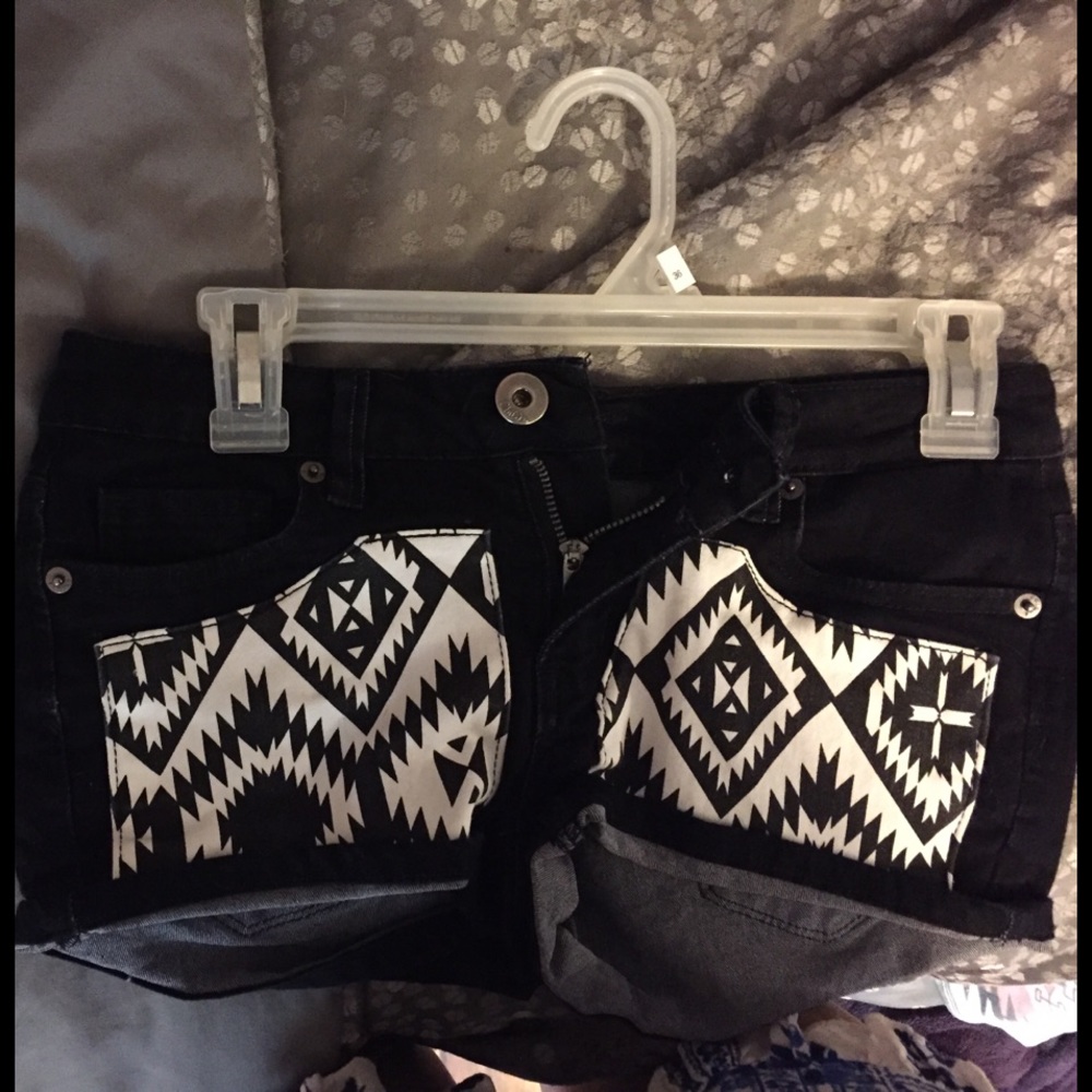 black shorts with white patterned pockets