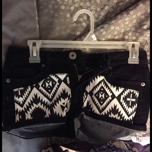 black shorts with white patterned pockets