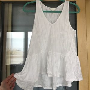 White tank top asymmetrical peplum