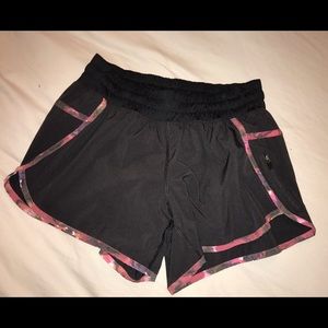 Black w various shades of pink lululemon shorts