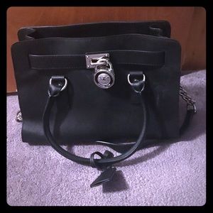 Black Michael Kors silver lock bag