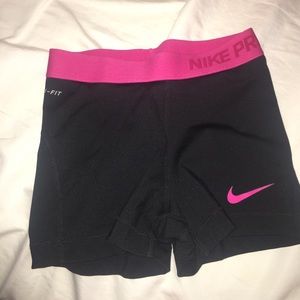 Pink and black Nike pro athletic shorts