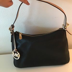 Michael Kors black/tan purse.