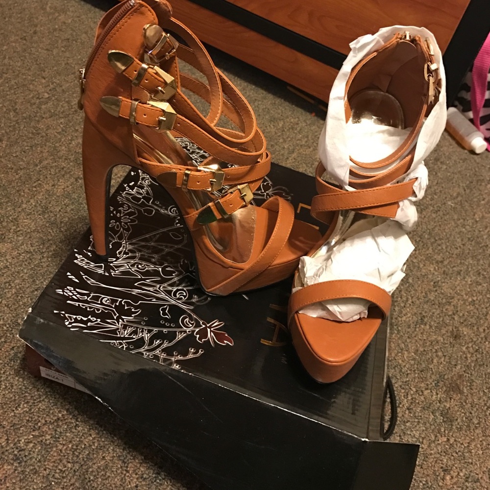 Tan heels with gold buckles