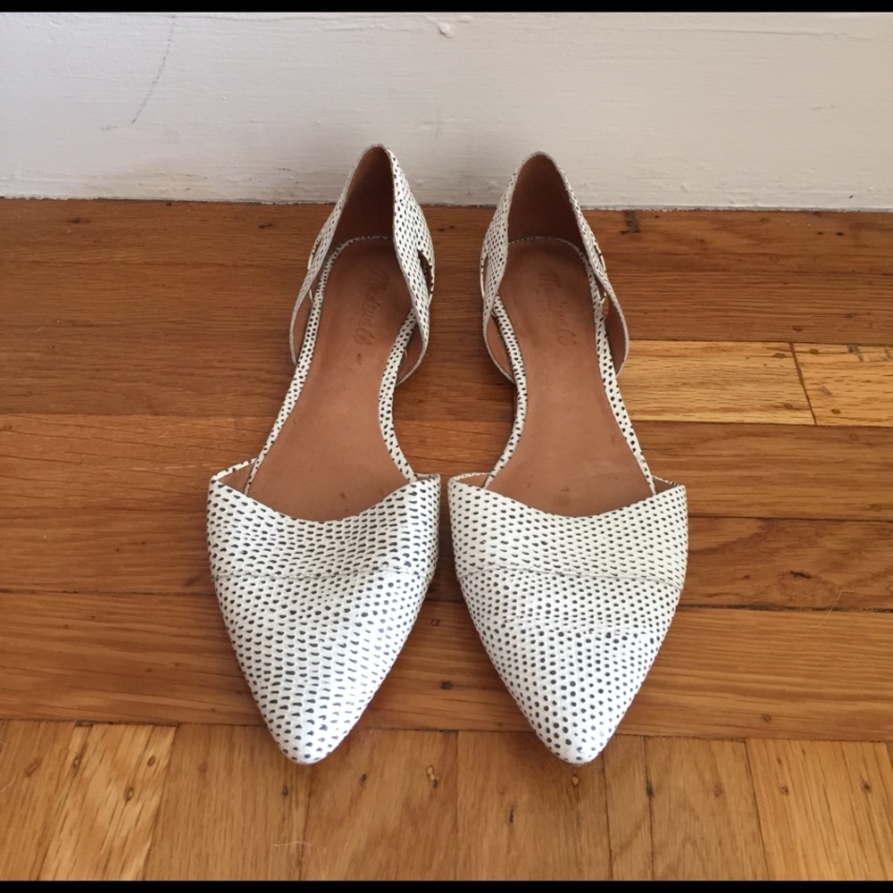 Black and white embossed leather flats