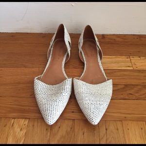 Black and white embossed leather flats