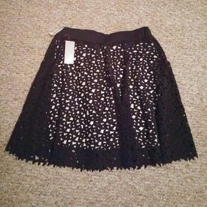White skirt with black overlay size Large