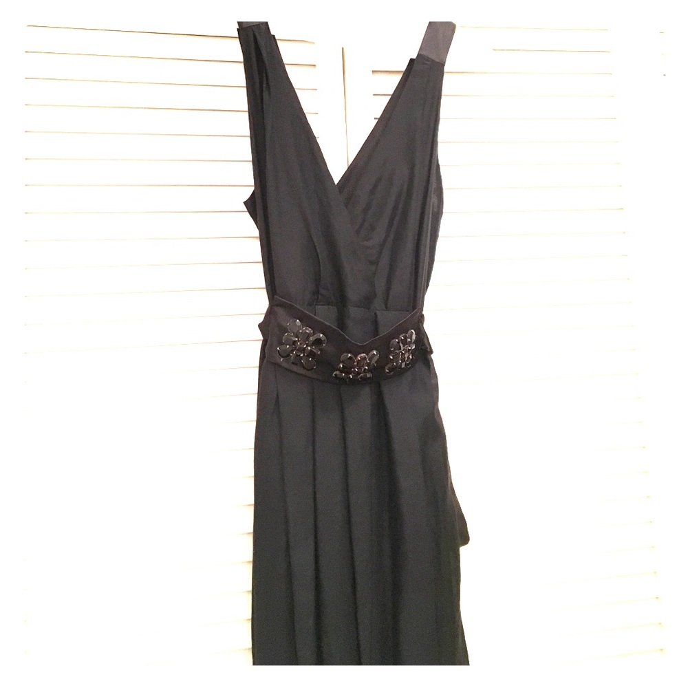 Black dress with embellishment. Ties in the back.