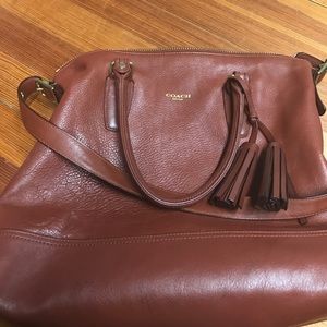 Authentic Coach bag with a handle and a strap