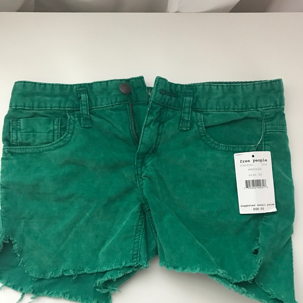 Free People green corduroy cut off shorts