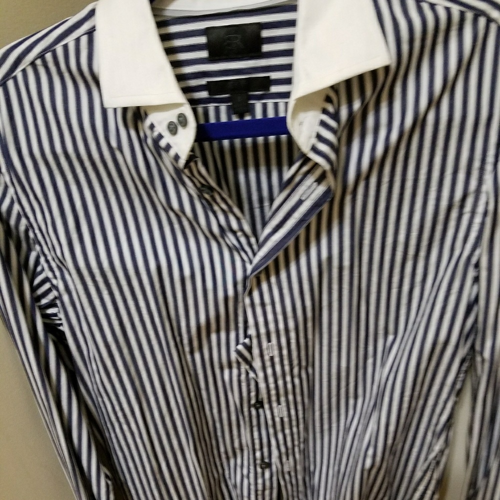 Navy and white shirt..white collar and handcuffs