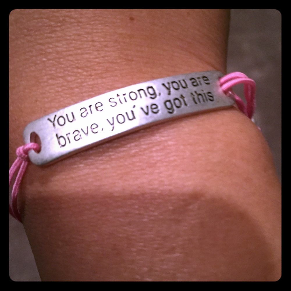 Pink stretch bracelet with motivational saying.