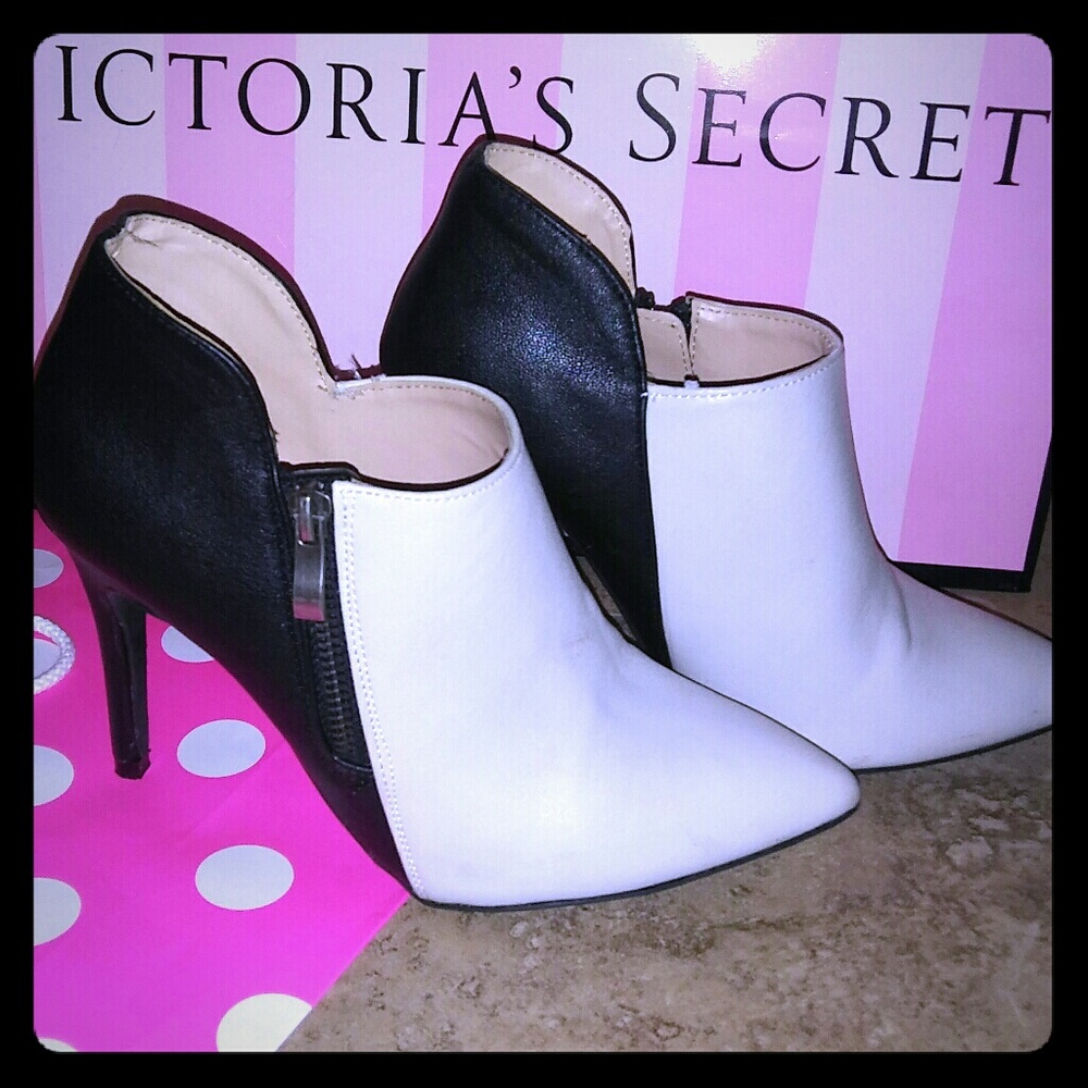 Cream and black pointed toe heels