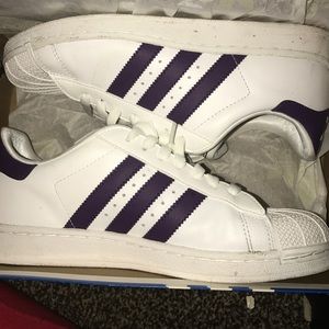 Adidas shell tops. White w/ purple stripes.
