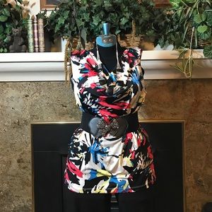 Red, black, yellow, grey and blue top