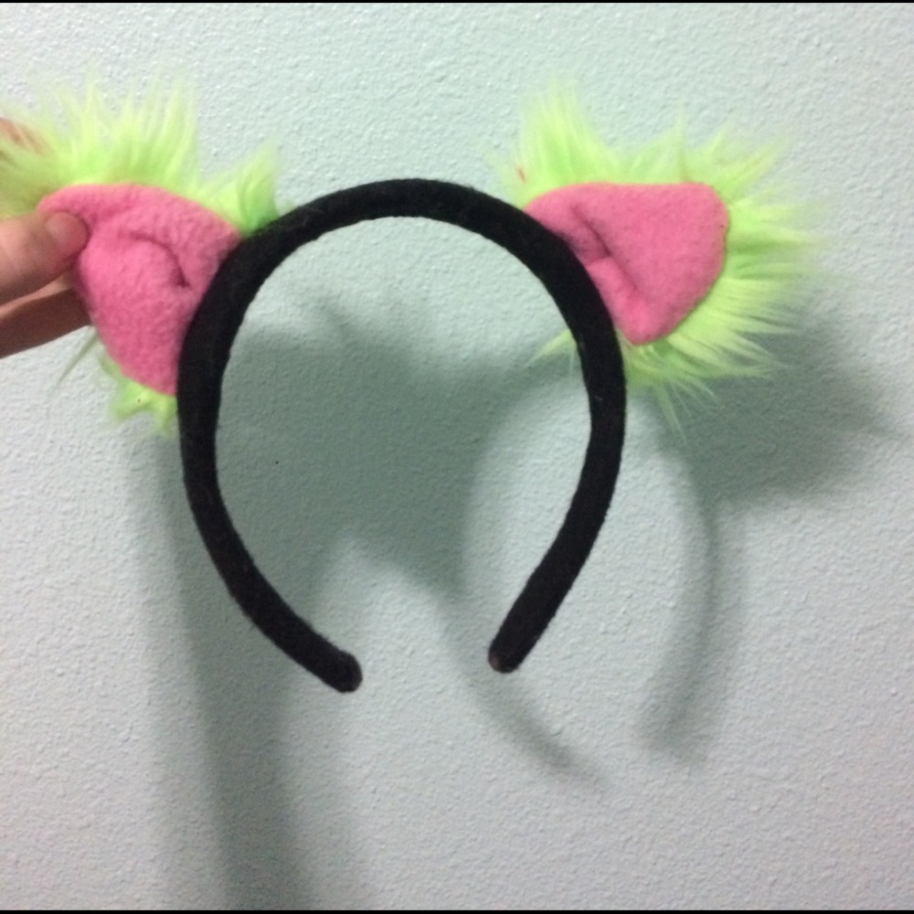 A fury cat ear headband. Pink and Green.