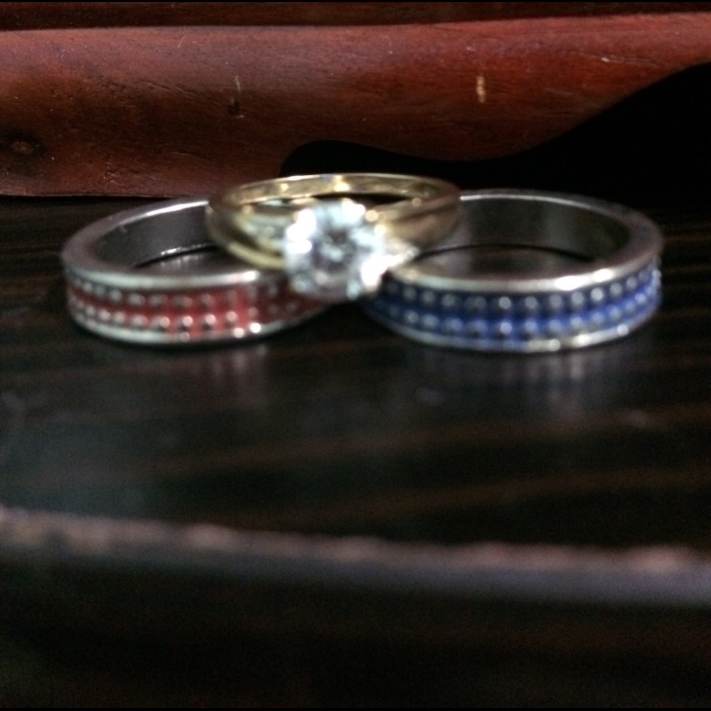 A 3 piece ring bundle. Blue, Red and Stud