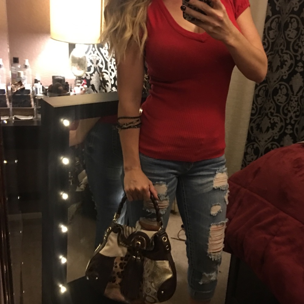 Red v-neck and black heels