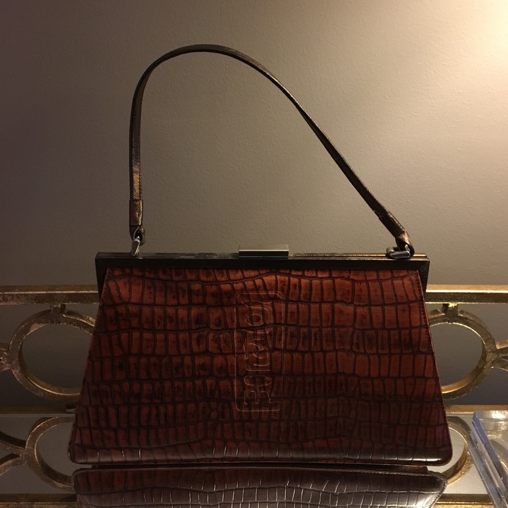 Brown and bronze leather lady handbag.